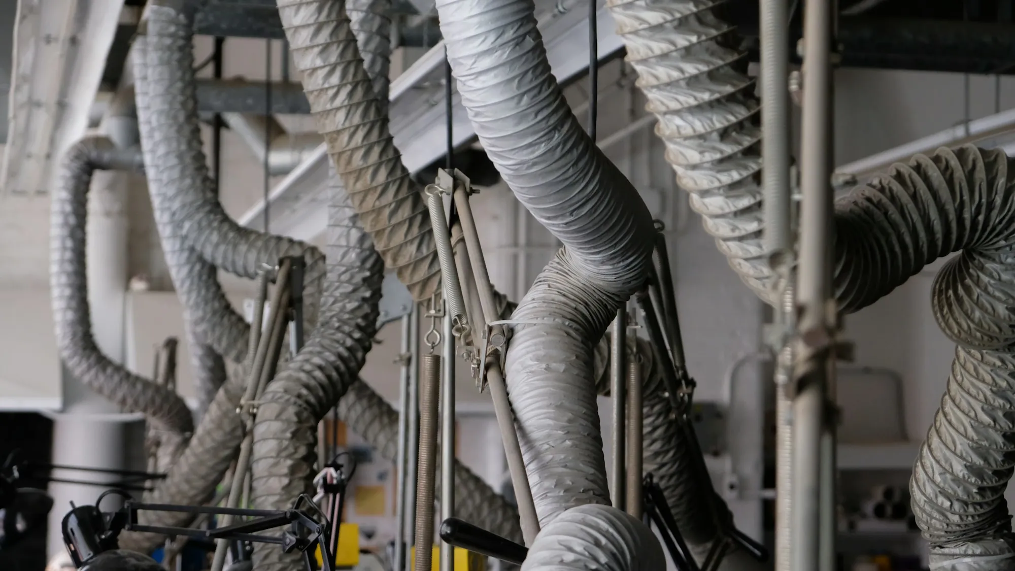 Flexible ducts hanging above commercial equipment